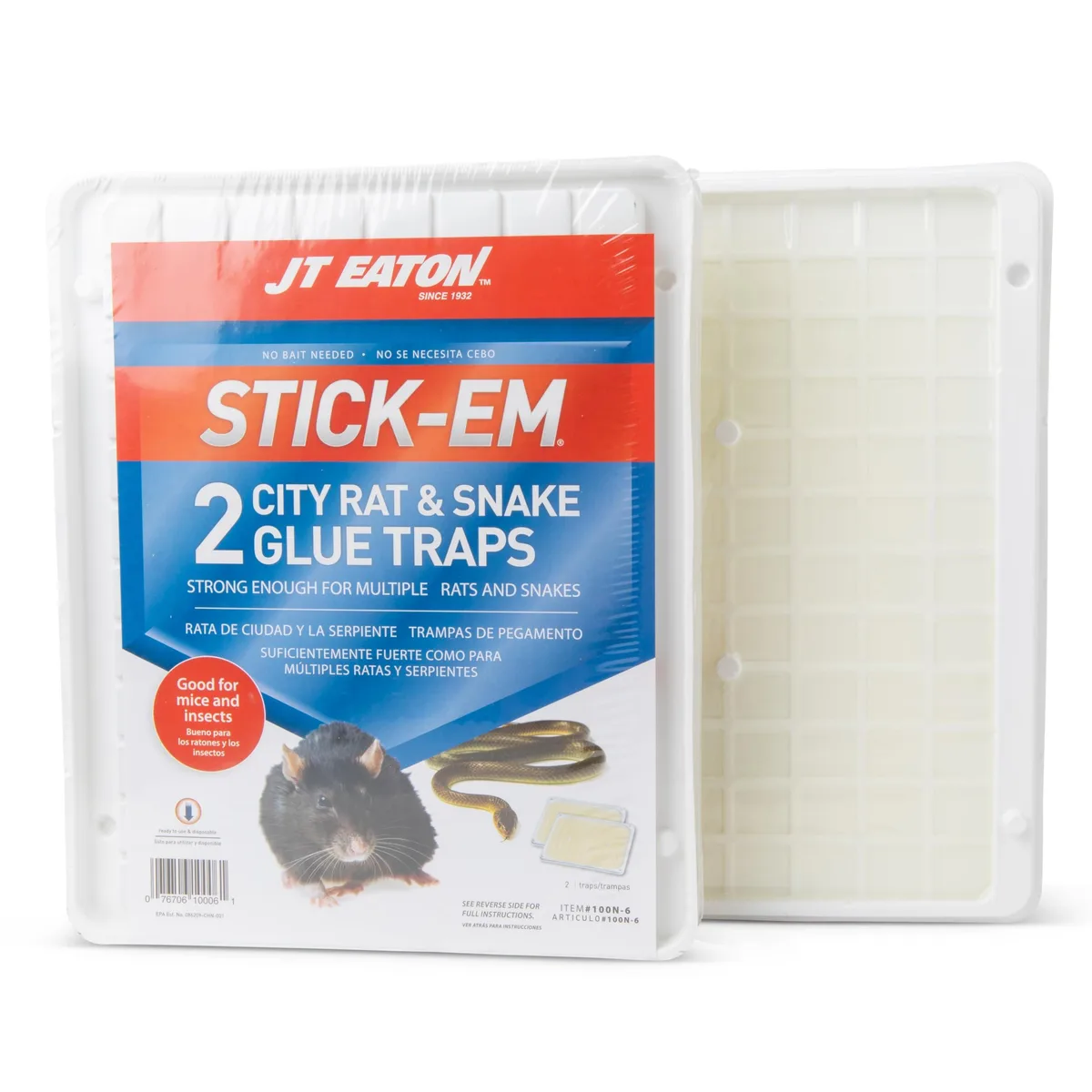 Large rectangular glue trap on a flat surface, light tan adhesive coating visible