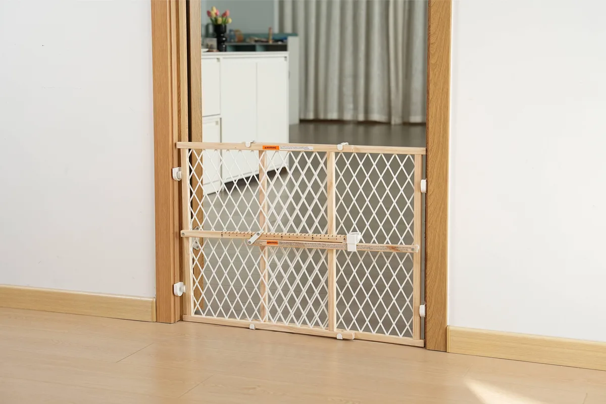 Wooden brown safety gate, adjustable 26 to 42 inches wide