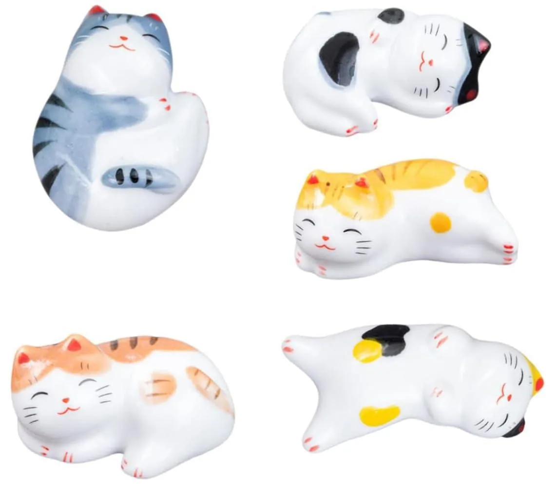 Five white ceramic cat chopstick rests, polished finish
