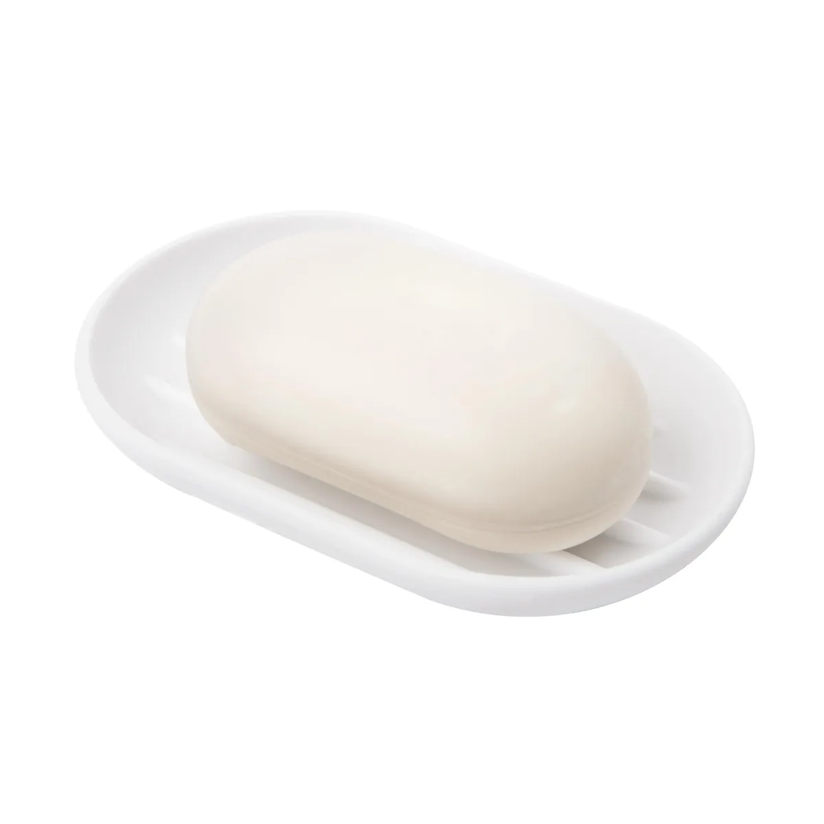 White plastic soap dish with curved shape and raised drainage ridges