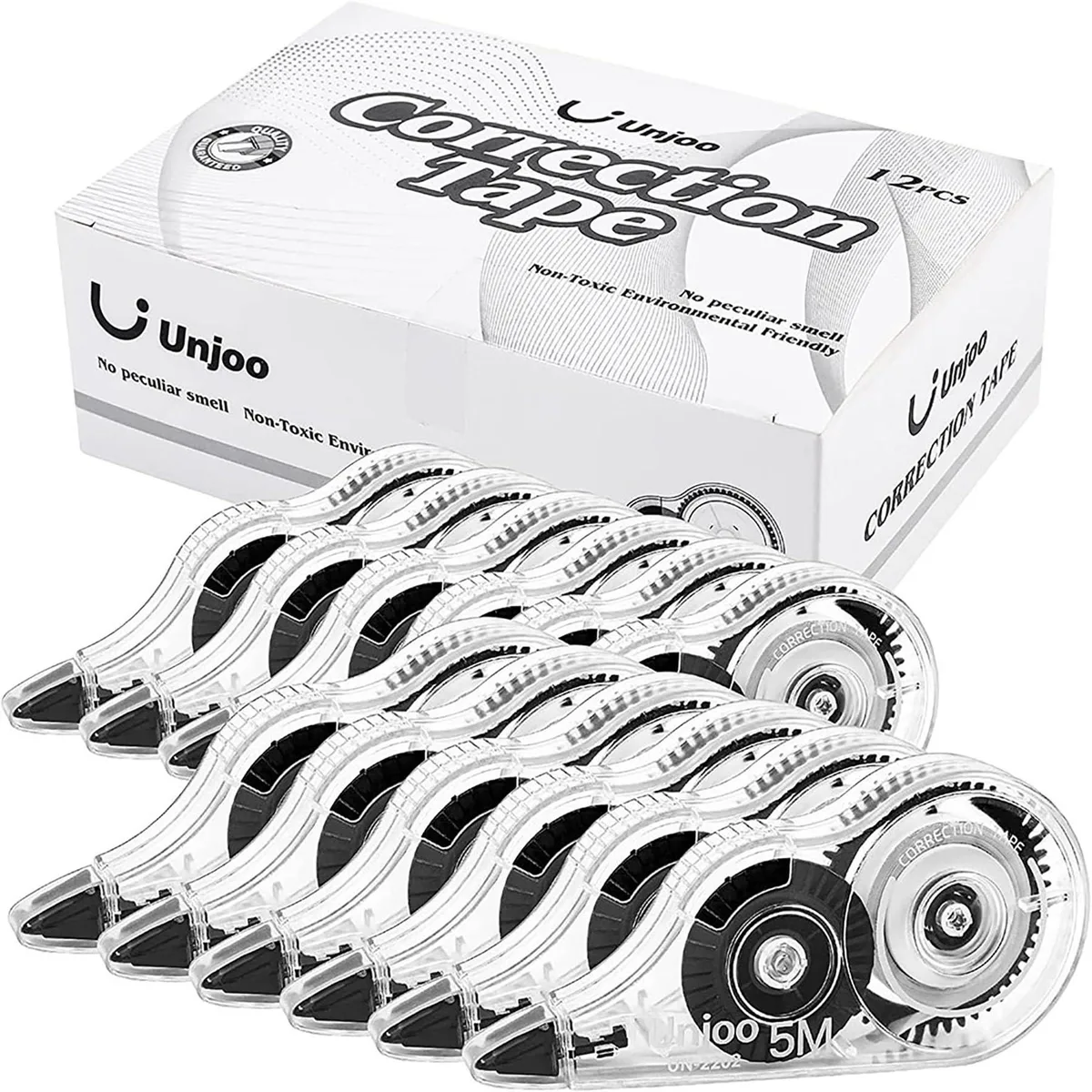 Twelve black plastic correction tape dispensers with white tape visible through clear windows