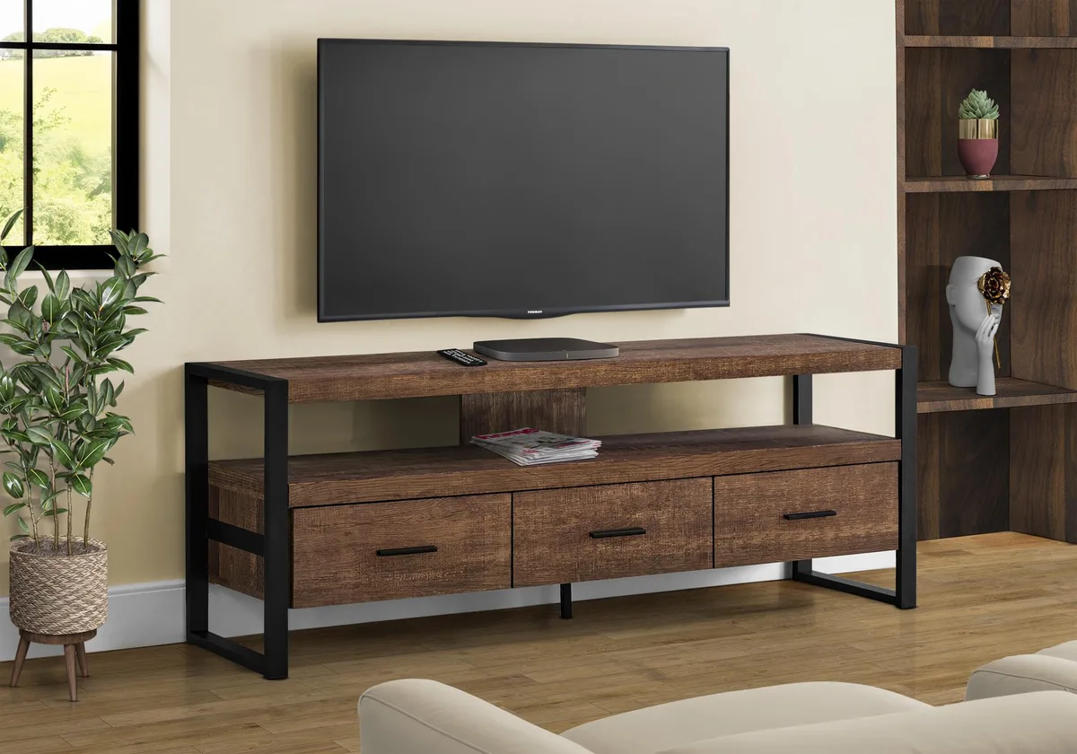 Brown laminate TV console with black metal frame, three drawers and open shelf