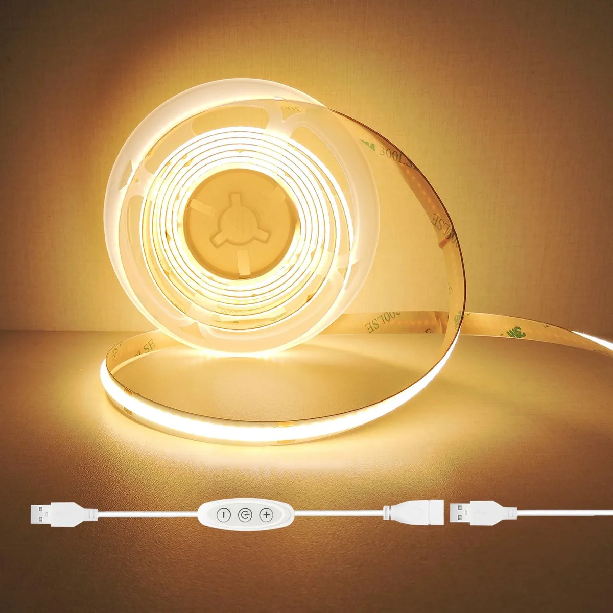 A flexible white LED strip on a reel with an inline USB dimmer control