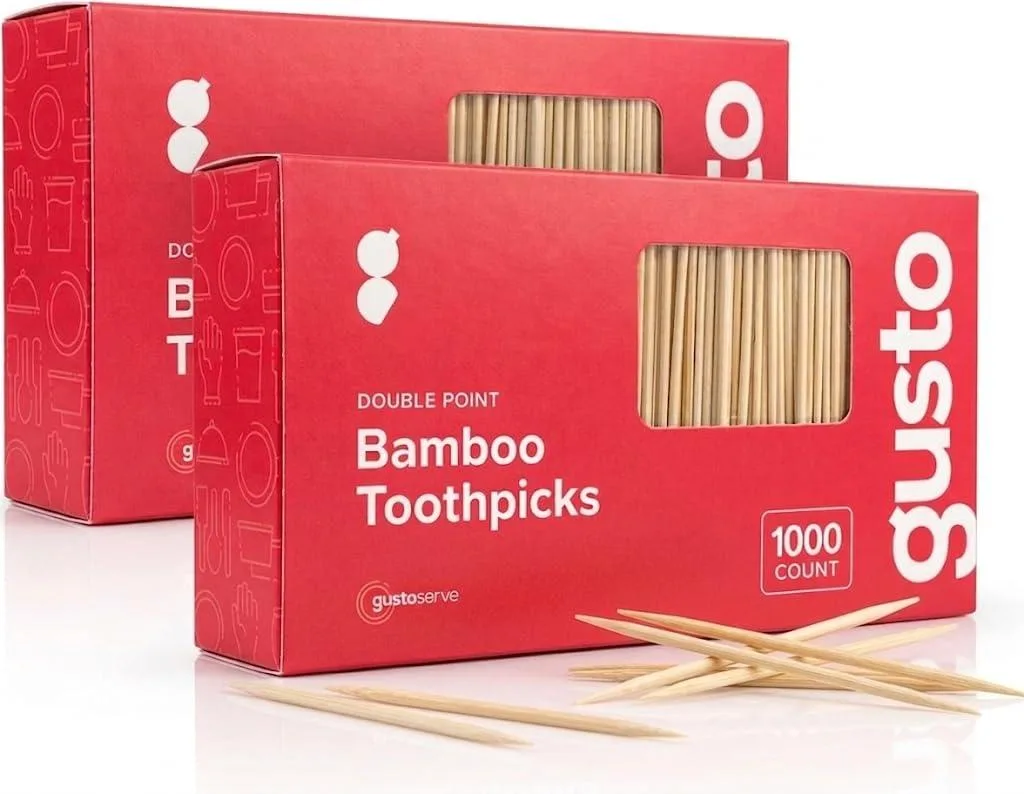 White rectangular box with green accents and bamboo toothpicks visible inside