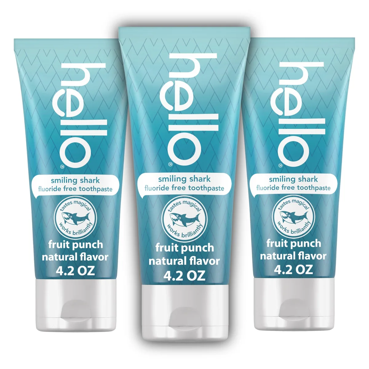 Three blue toothpaste tubes with shark graphics in a row