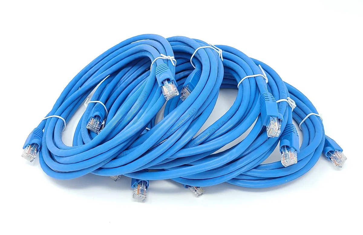 Five blue Cat6A patch cables coiled together, 14 ft each, snagless boots, gold RJ45 plugs