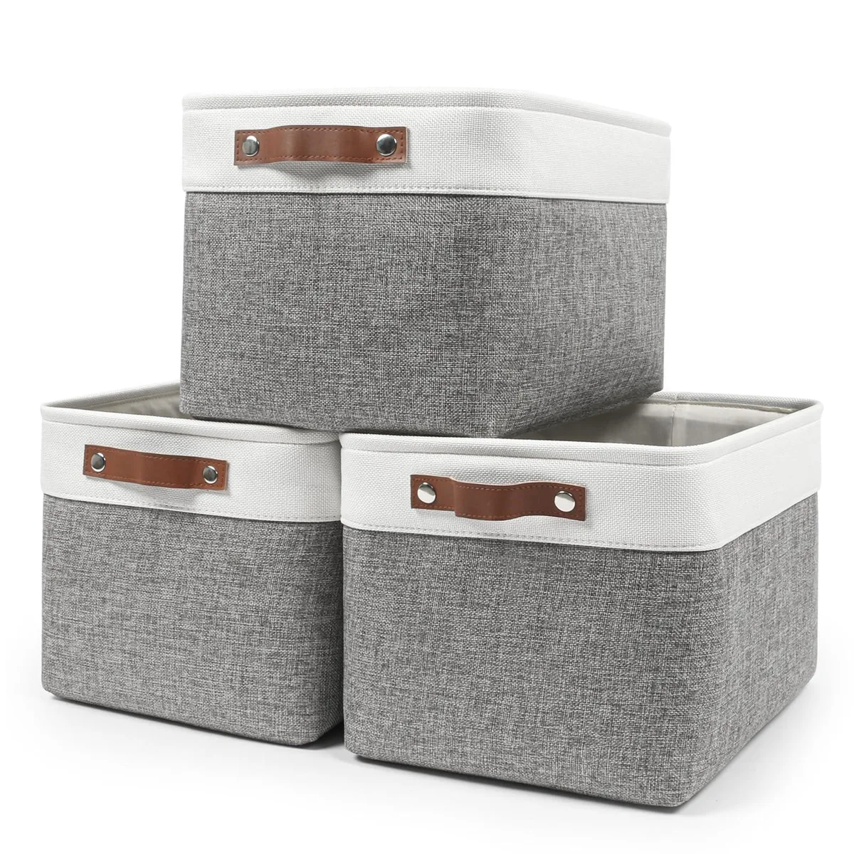 Three rectangular fabric storage baskets in grey and white with leather handles