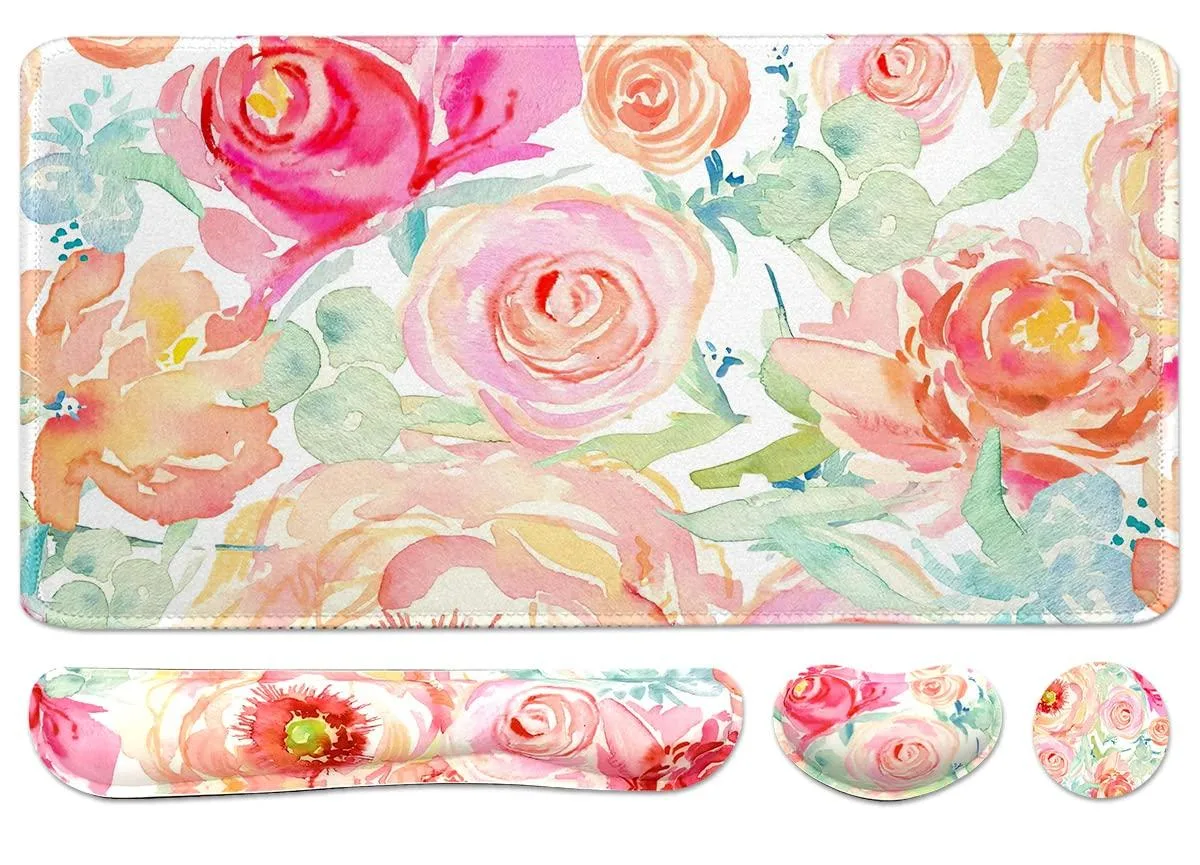 Floral-patterned cloth desk mat with matching keyboard and mouse wrist rests and a square coaster