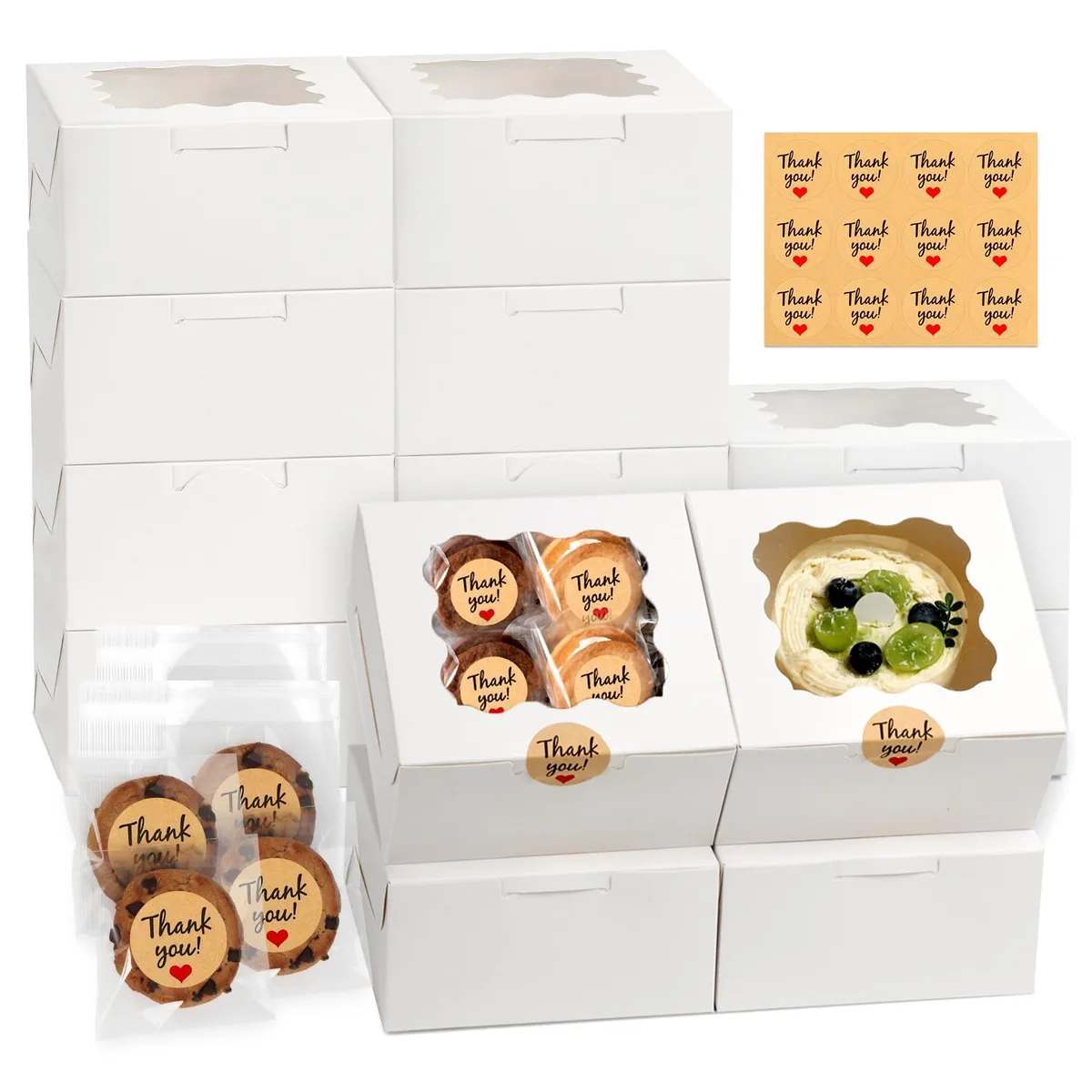 Twelve white bakery boxes with clear window, flat-packed, plus cookie bags and stickers