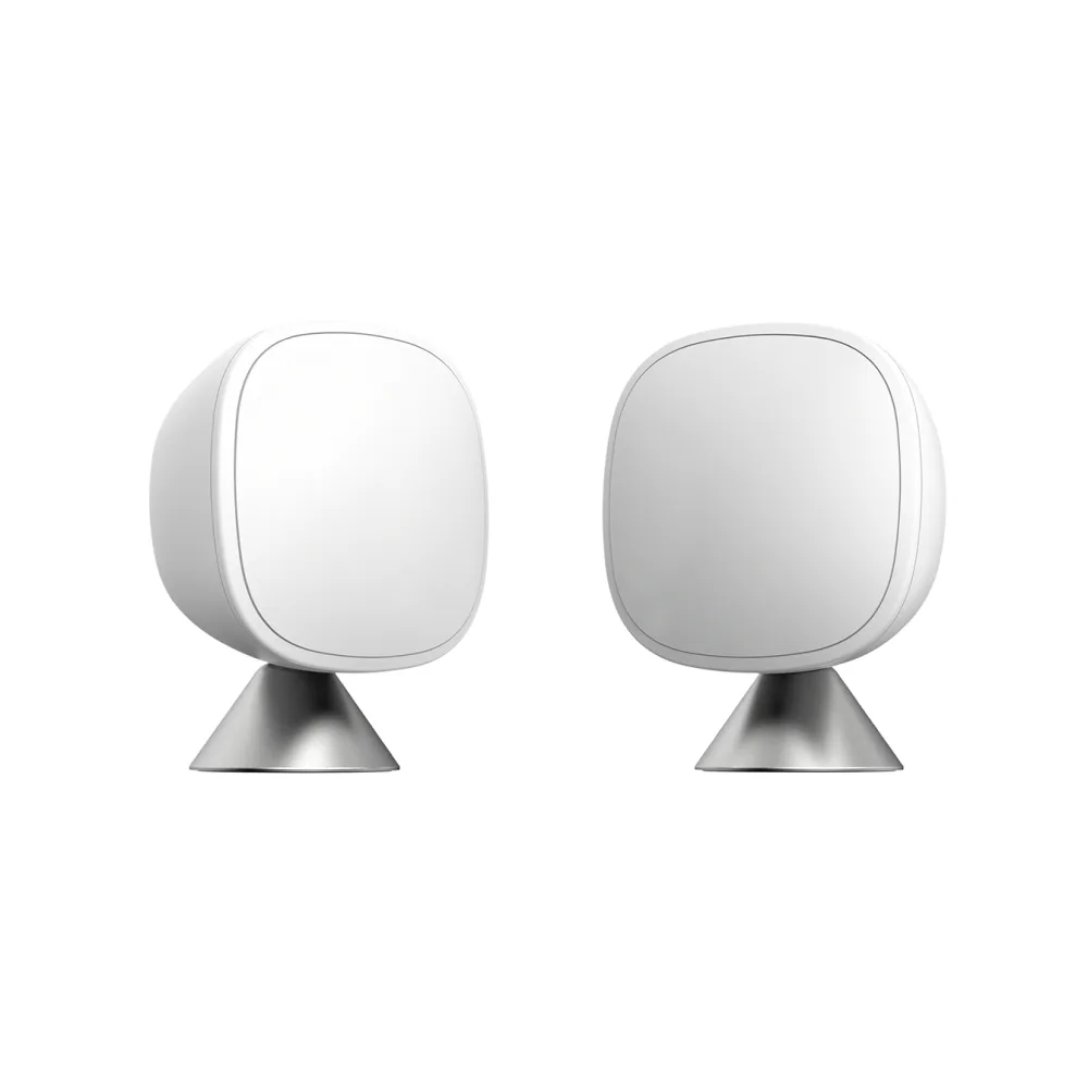 Two small white square sensors with detachable stands and wall brackets