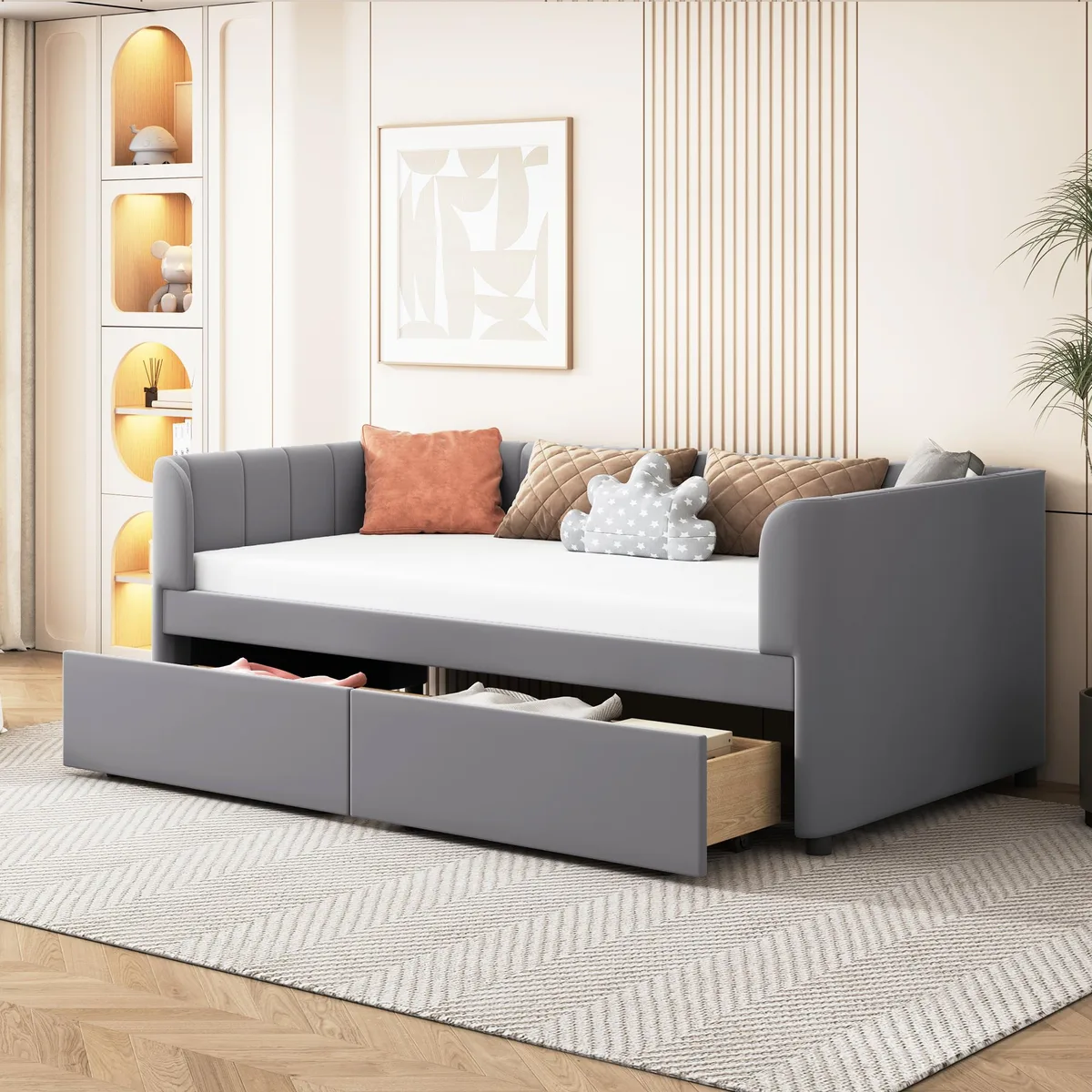 Gray velvet upholstered twin daybed with striped backrest and two front drawers