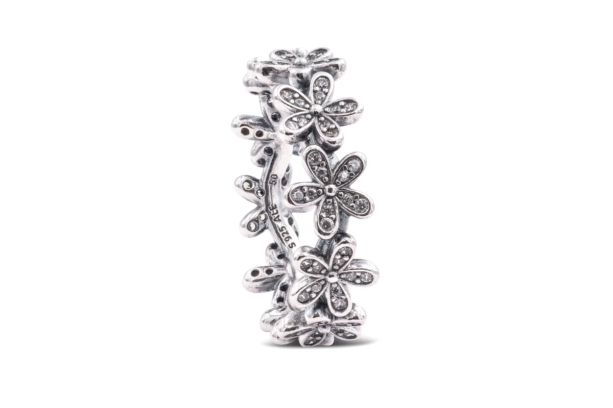 Sterling silver ring with linked cubic zirconia daisies
