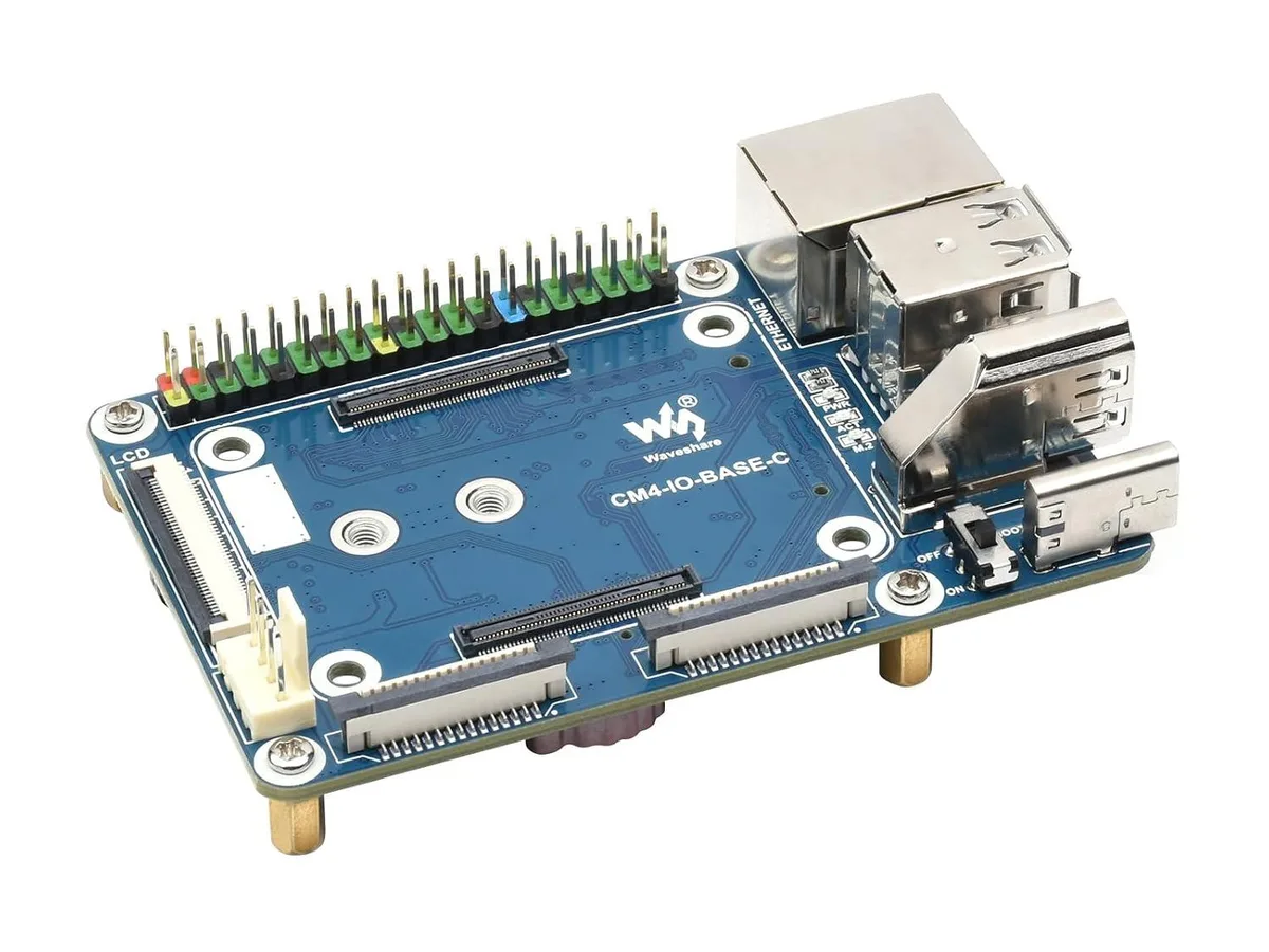 Green rectangular circuit board with CM4 socket, color-coded 40-pin GPIO header, HDMI, USB, RJ45, CSI, FAN, LCD