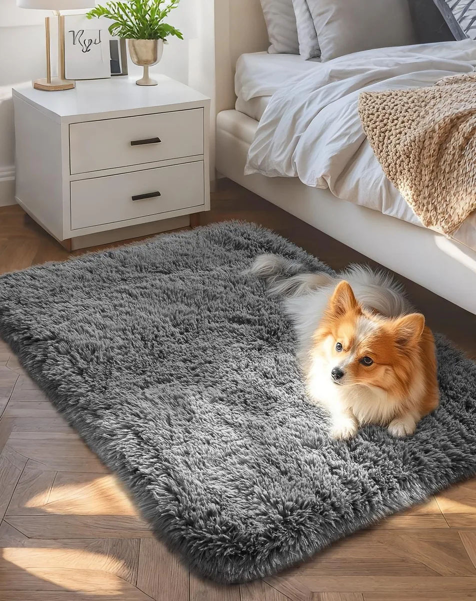 Rectangular grey polyester rug 36 by 24 inches high pile non-slip backing