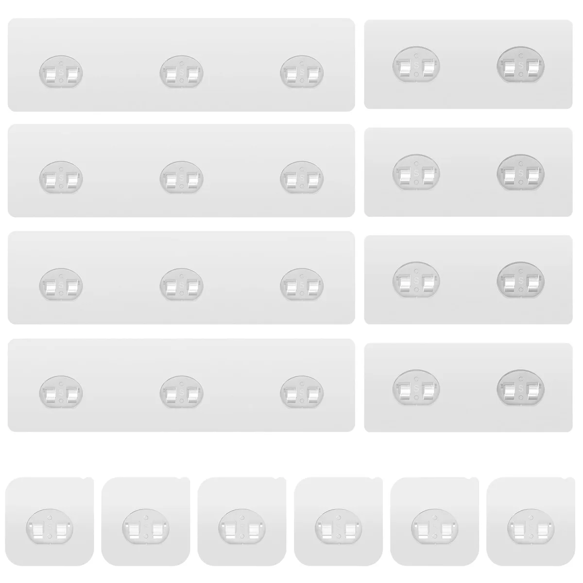 Fourteen transparent polycarbonate adhesive hooks — four triple, four double, six single — on a white backing sheet