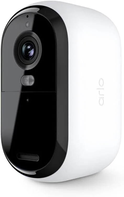 White wireless security camera with integrated spotlight, compact rectangular shape
