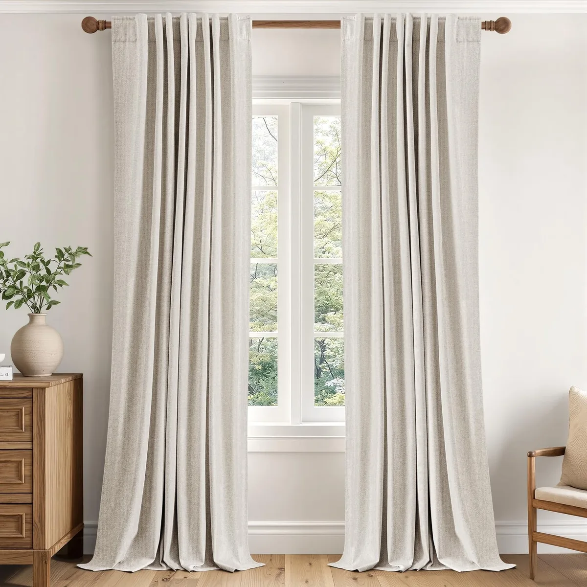 Two cream polyester curtain panels, 40 by 84 inches, linen look with white backing