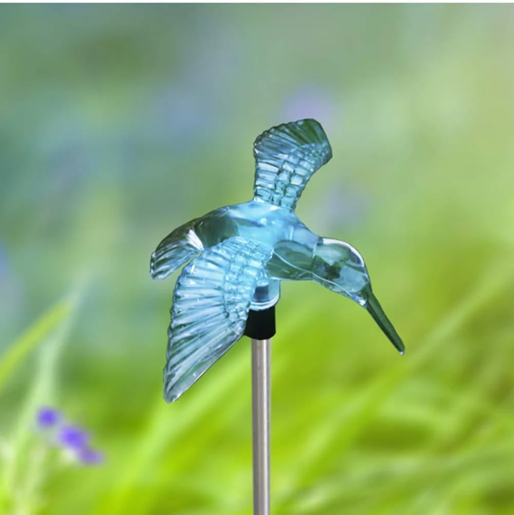 Two black hummingbird stake lights with solar panels