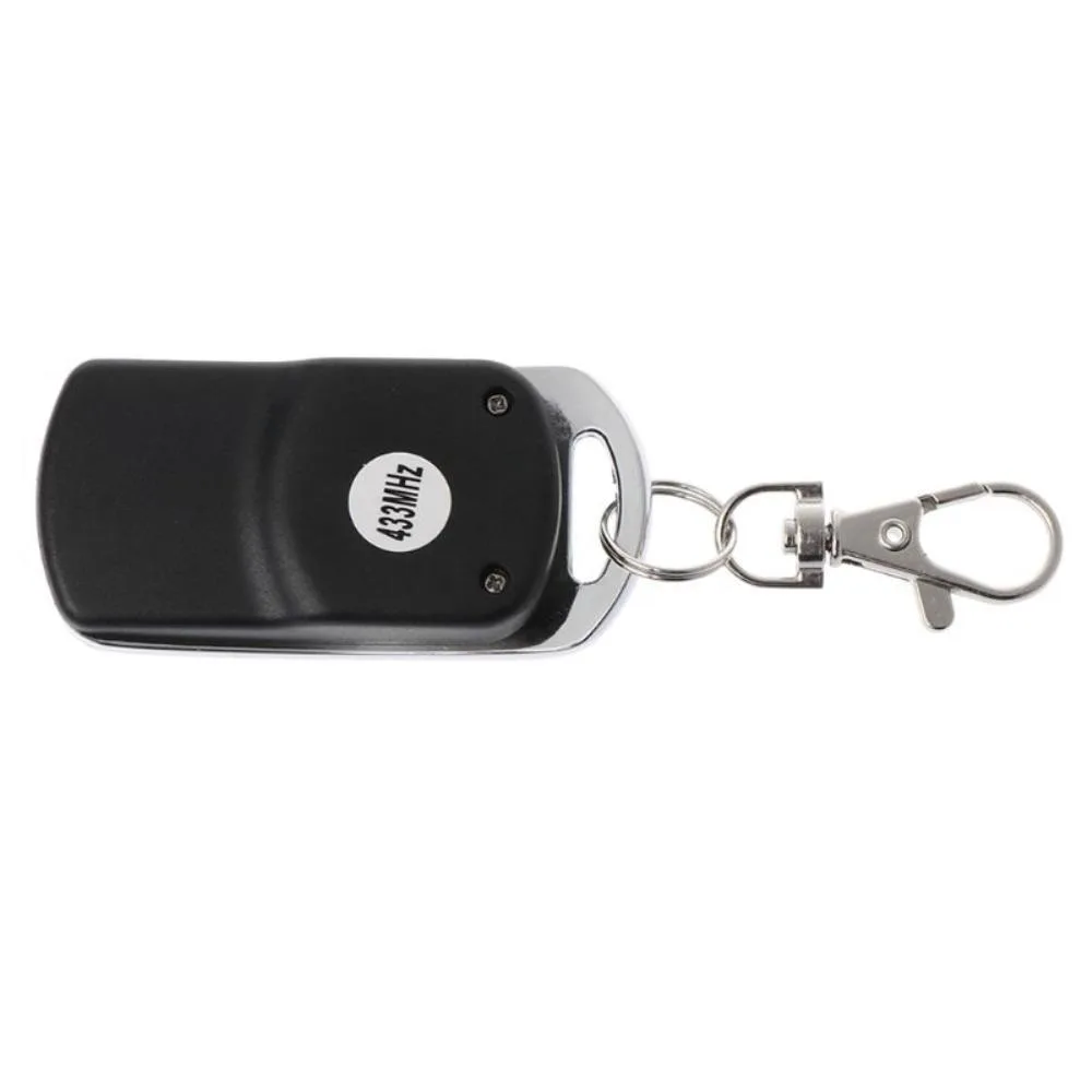 Small black plastic remote with four buttons, 6.0 by 3.0 by 1.2 cm