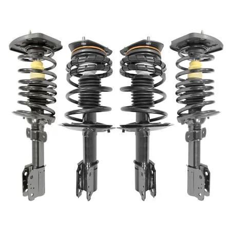 Four silver strut assemblies with black springs on a pallet
