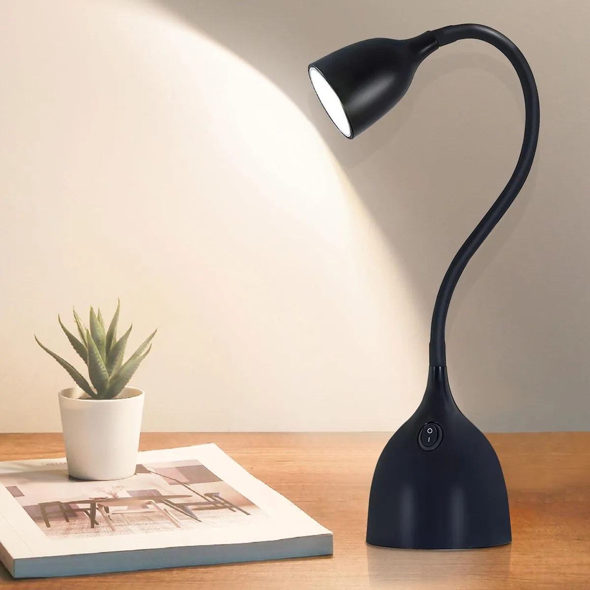 Black matte gooseneck desk lamp with flexible neck and plastic base