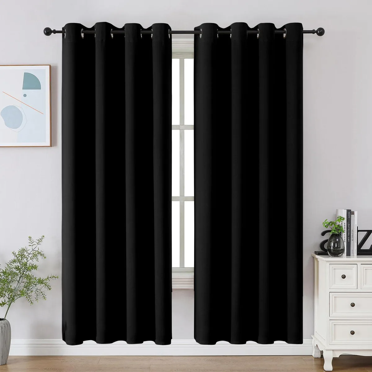Two black polyester curtain panels with silver grommets, 52 by 72 inches