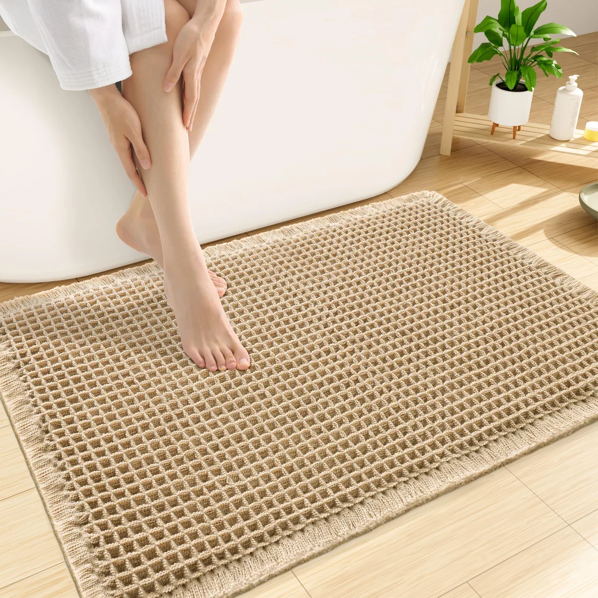 Rectangular brown polyester bath mat with waffle texture, 30 by 20 inches