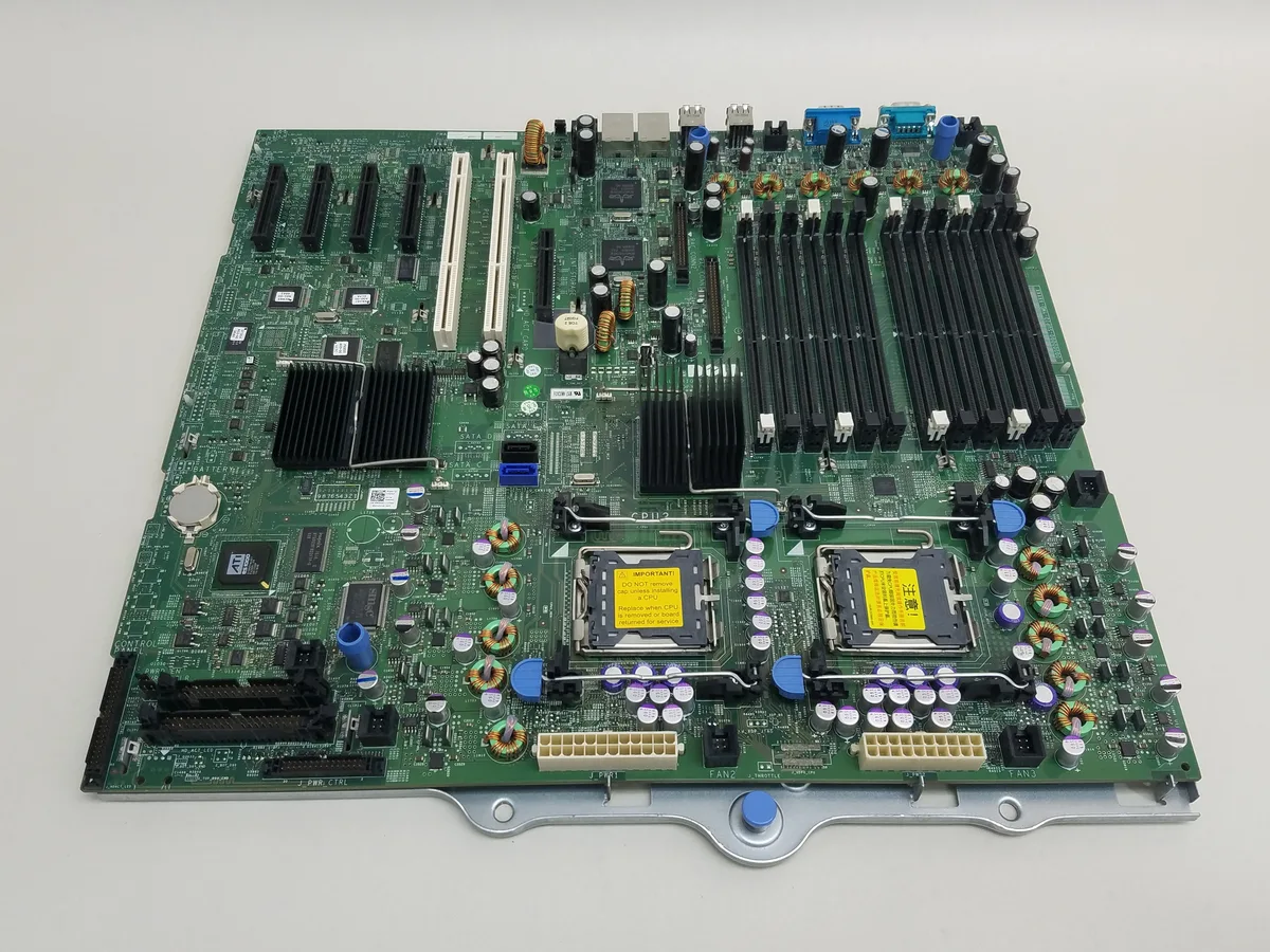 Green rectangular server motherboard with silver components and multiple expansion slots