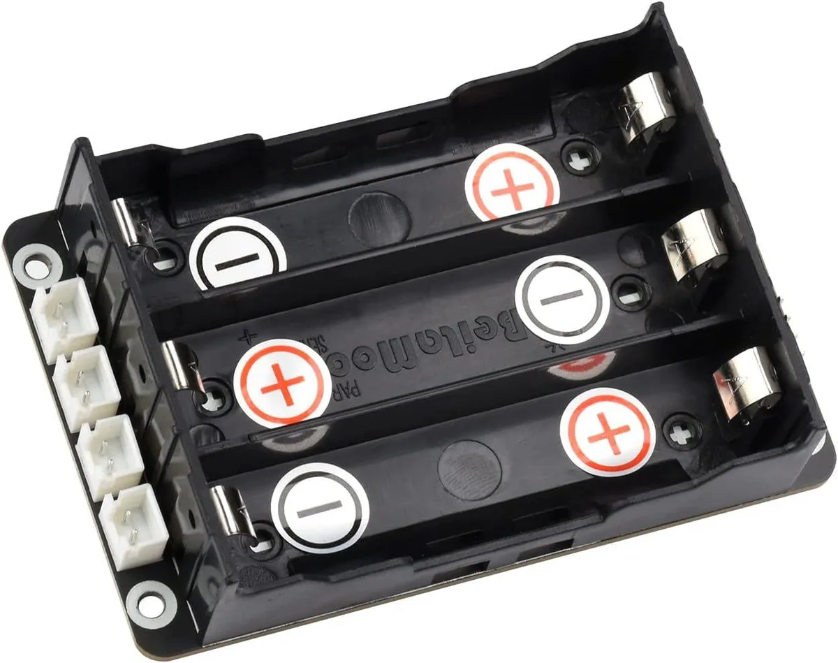 Green rectangular circuit board with screw terminals and battery connectors