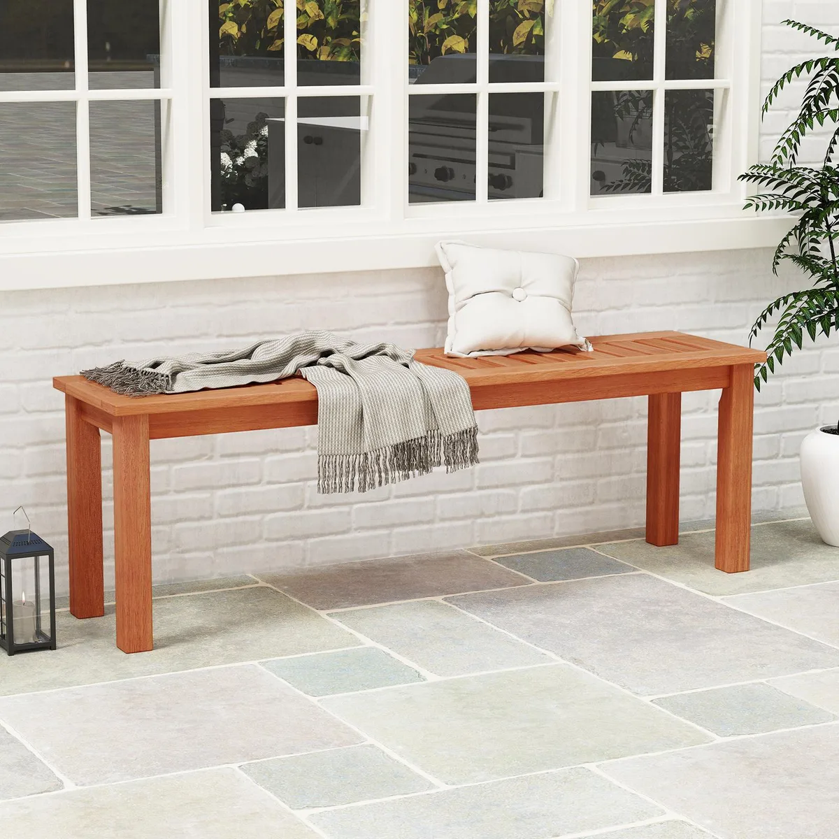 47 inch solid wood patio bench with slatted seat in teak finish