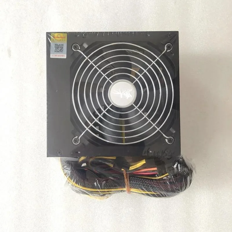 Rectangular metal ATX power supply unit with fan grille and power socket