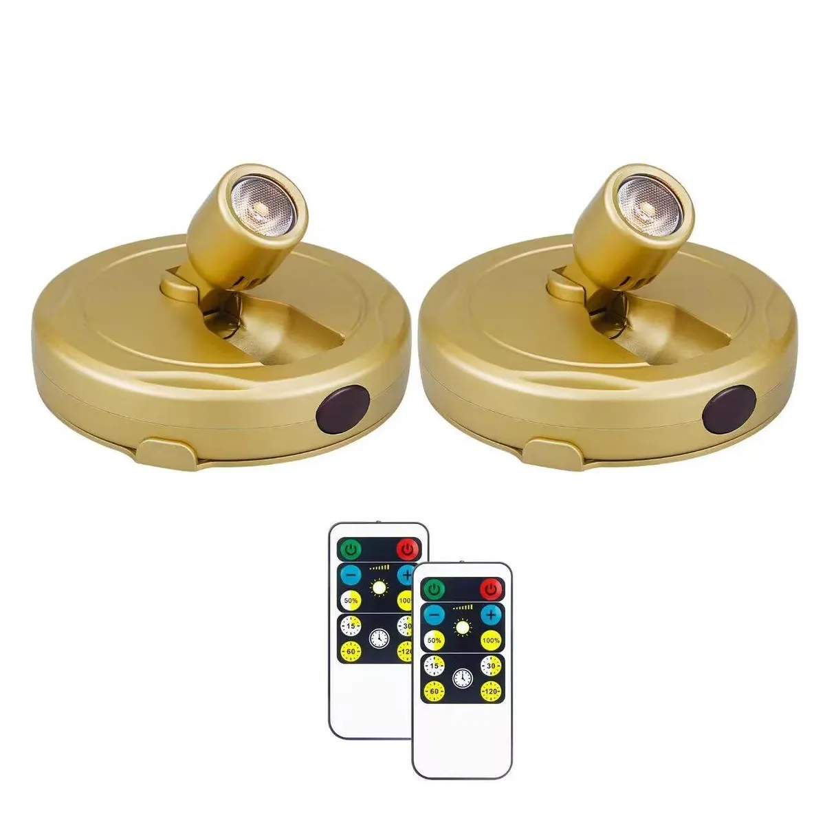 Two white round puck lights with clear prismatic lenses and a remote control