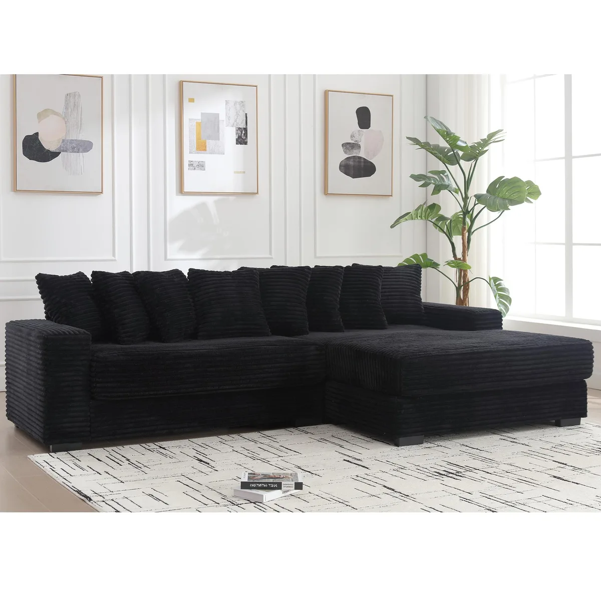 Black corduroy L-shaped sectional with right chaise and eight matching pillows