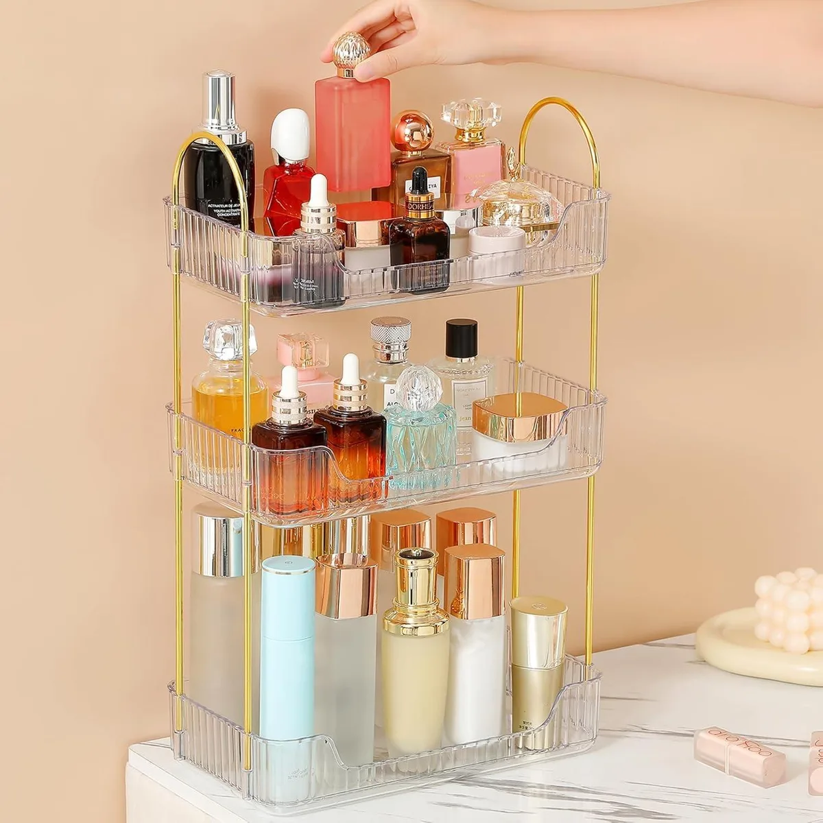Three-tier clear acrylic bath shelf with gold metal brackets, polished chrome finish, 11.8 by 6.7 by 18.9 inches