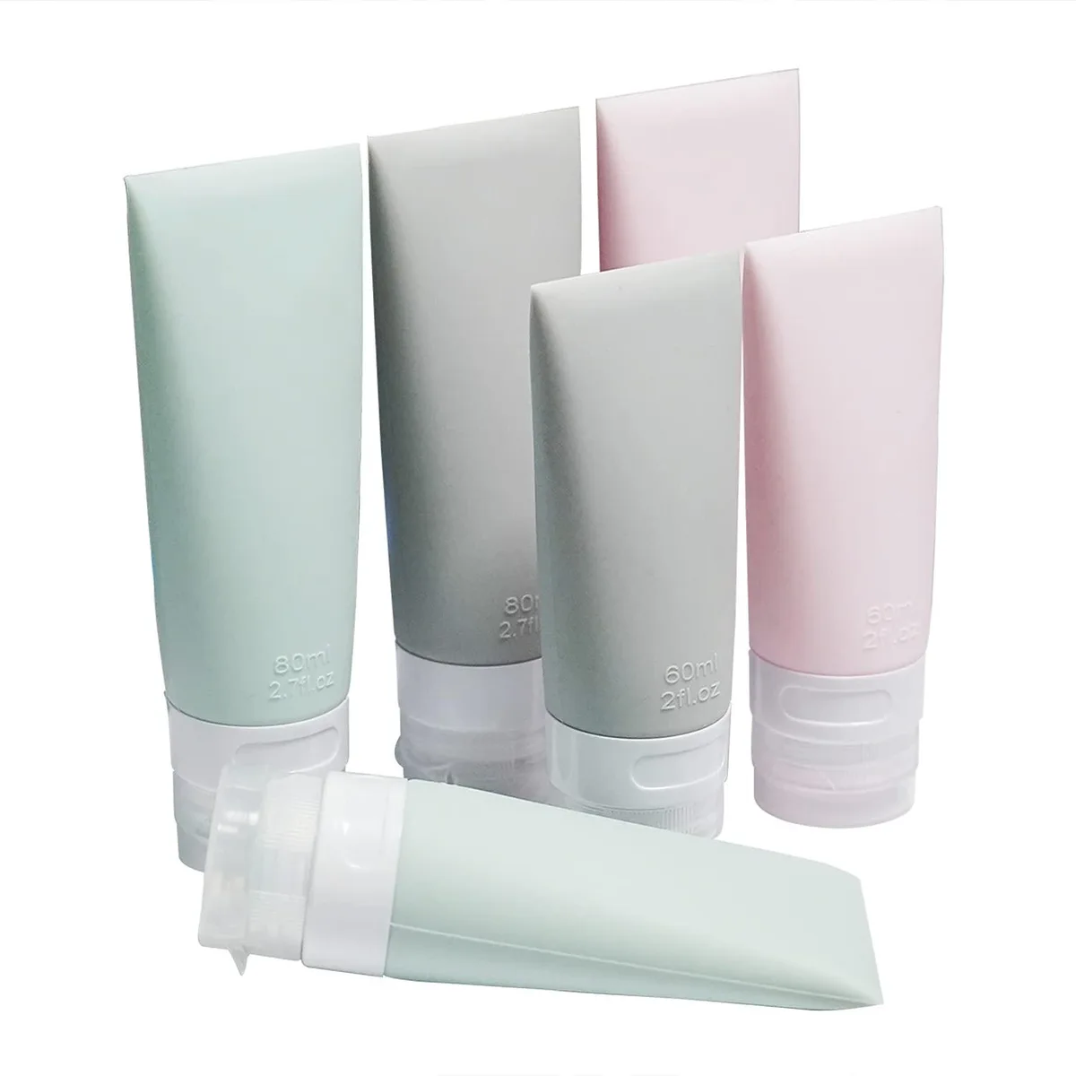 Six soft silicone travel bottles in pink, green and grey, three 60ml and three 80ml, with flip caps