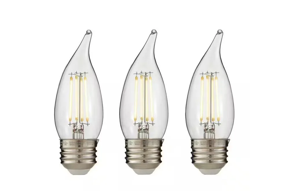 Three clear torpedo-shaped LED bulbs with visible filaments, frosted tips, standard screw bases, soft white finish