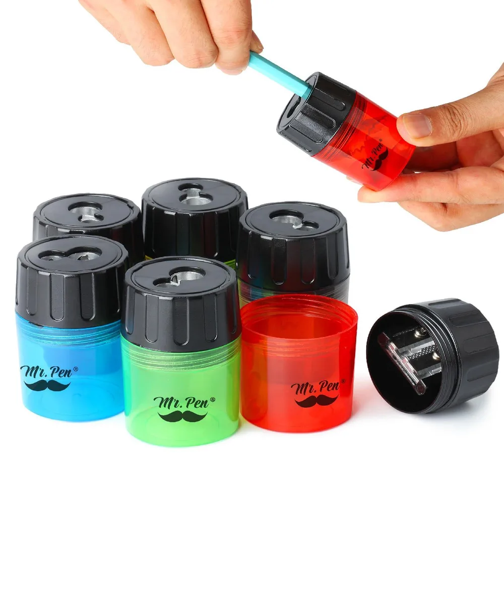 Six small plastic manual pencil sharpeners in assorted colours with a black screw-on lid container