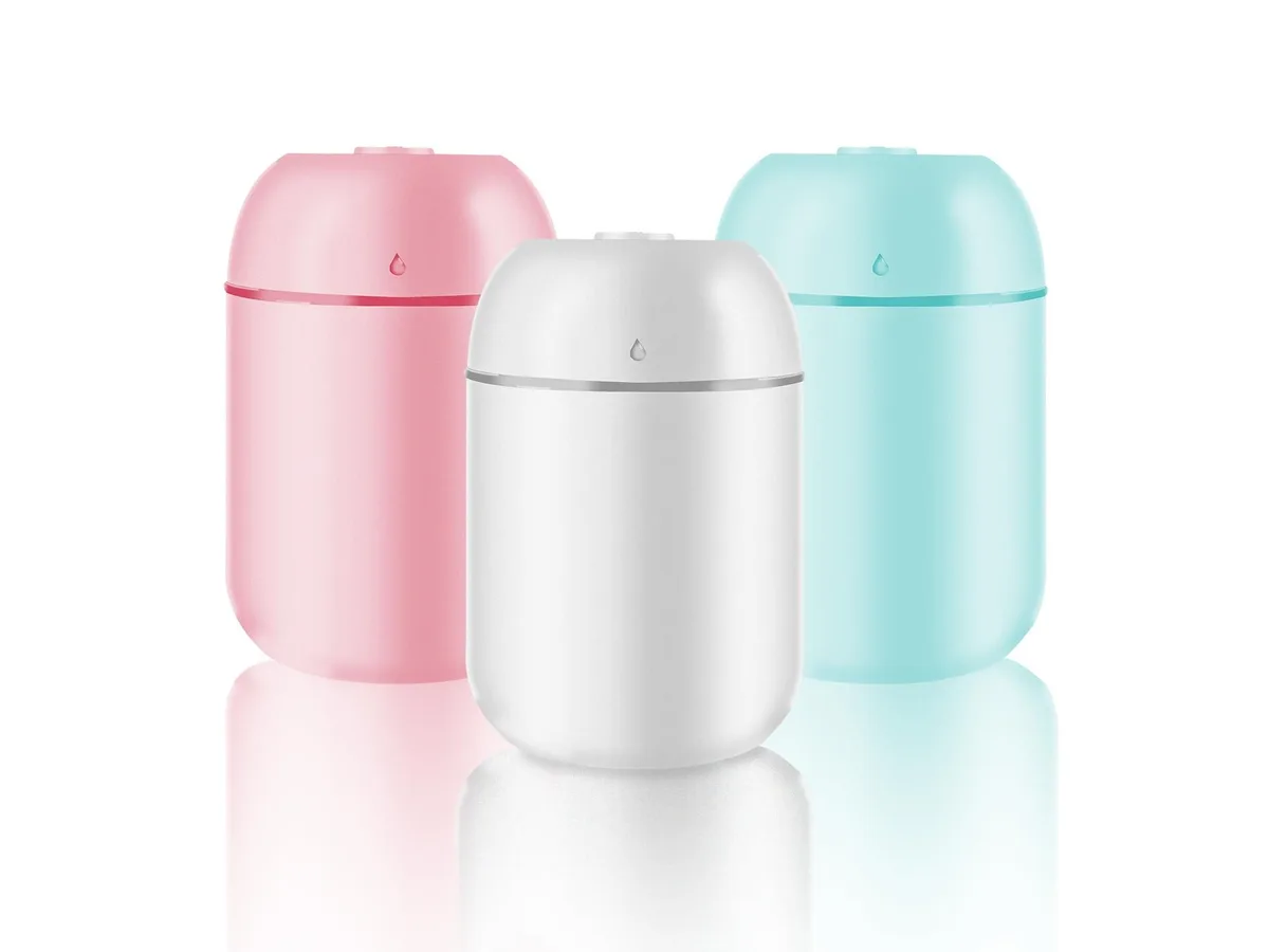 Three small white cool-mist humidifiers with 330ml tanks on a desk