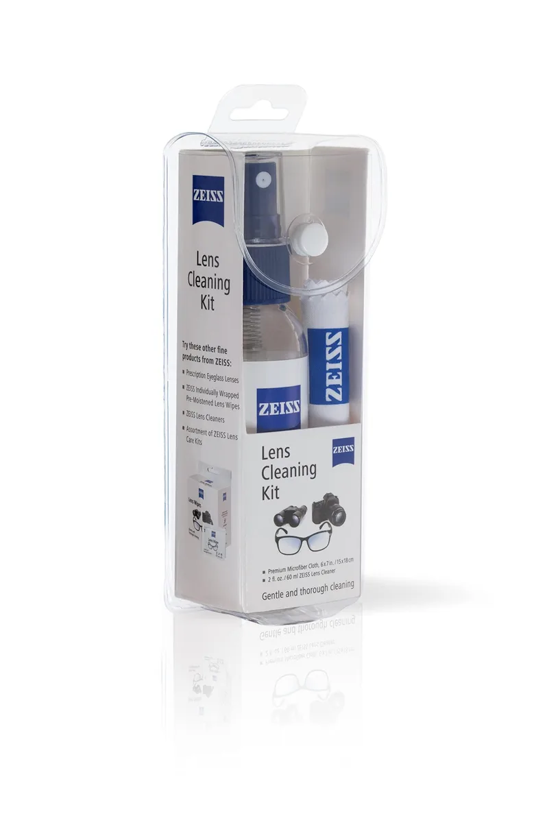 Small rectangular box holding a spray bottle and folded cloth