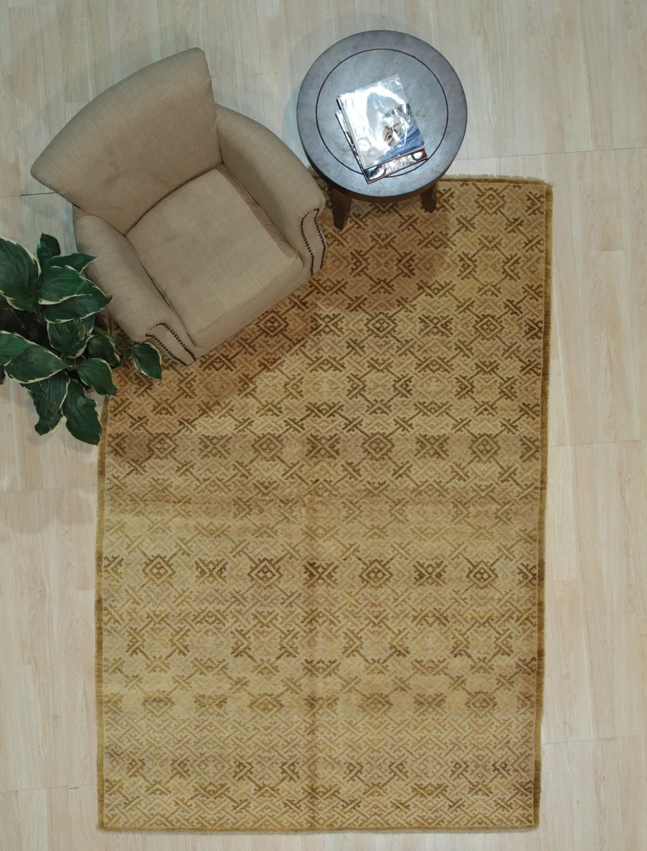 Hand-knotted brown wool rug with floral pattern, rectangular shape