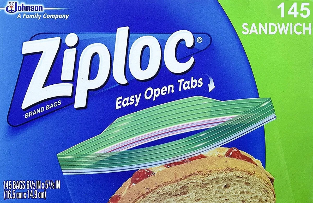 Clear rectangular plastic sandwich bags in a self-dispensing carton with zipper seal