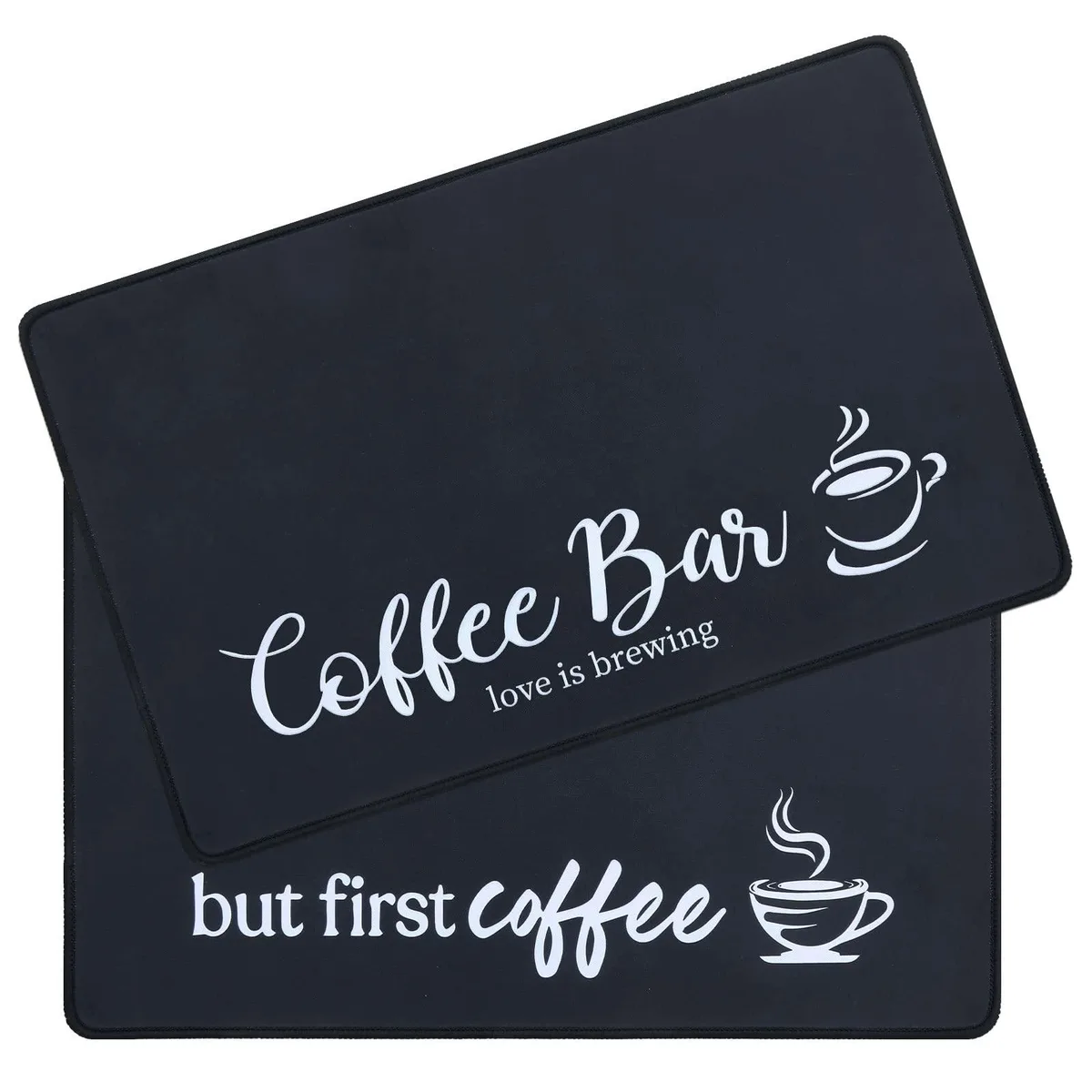 Two black rectangular coffee mats with textured polyester surface and rubber backing