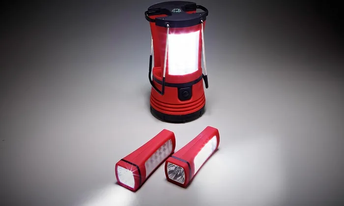 Red camping lantern with two detachable flashlights and carry handle