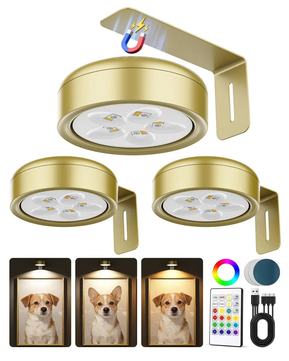 Three white acrylic puck lights with clear prismatic lenses and a remote control