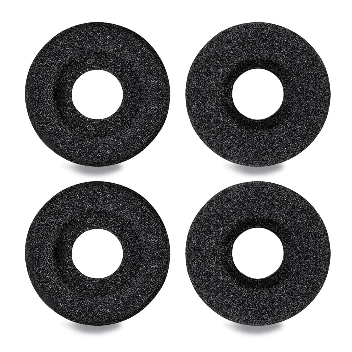 Four white foam doughnut ear pads with centre holes