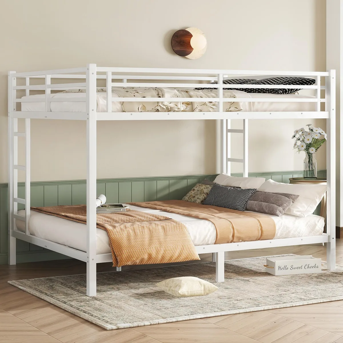 White metal queen-over-queen bunk bed with side ladders and guardrails