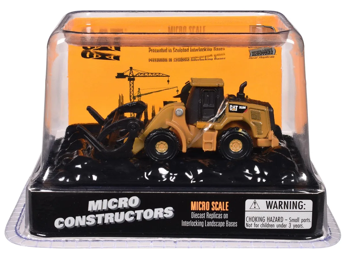 Yellow diecast CAT 950M wheel loader with log fork attachment on clear display base