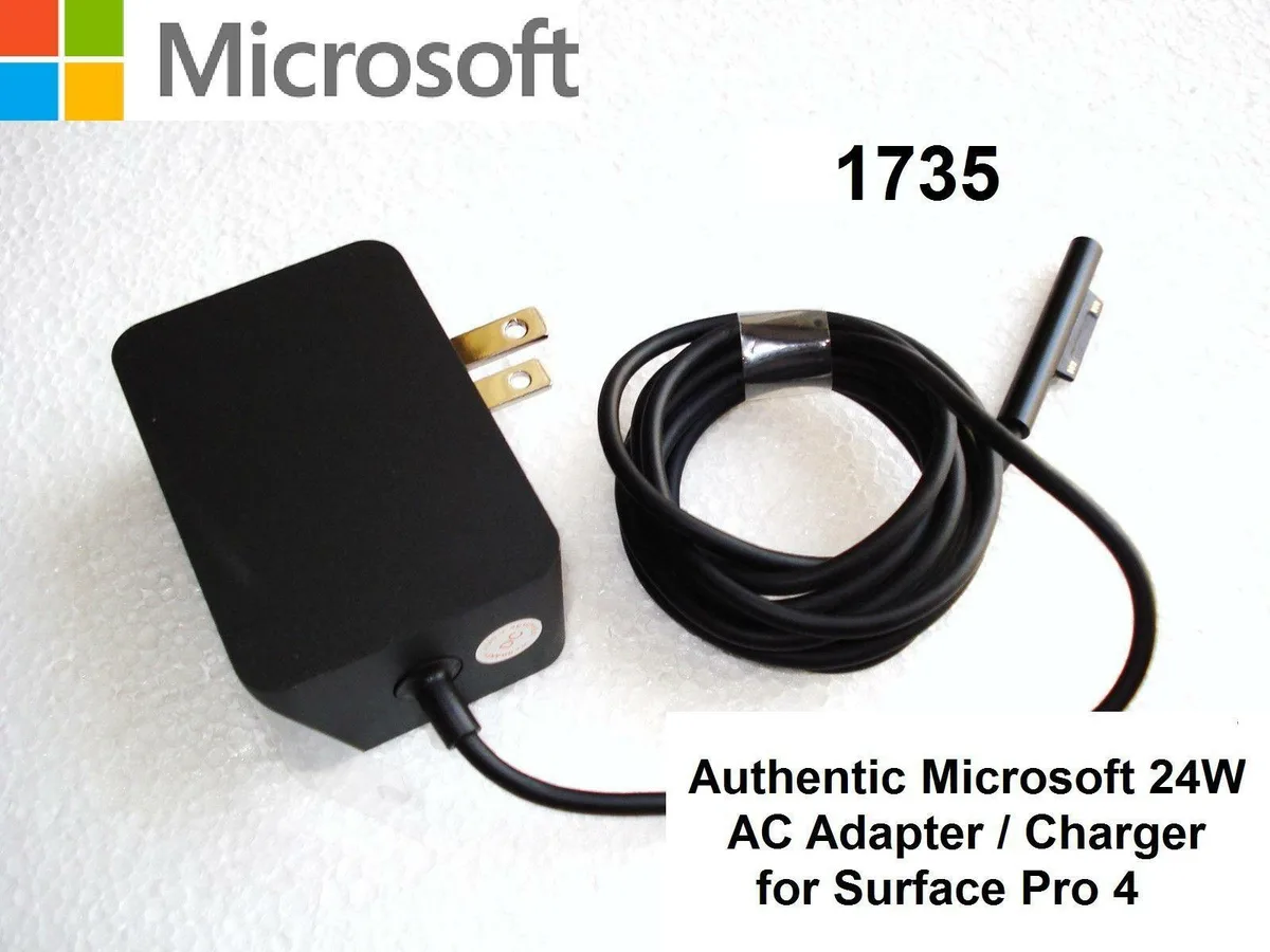 White rectangular AC adapter with Microsoft branding and model number 1735