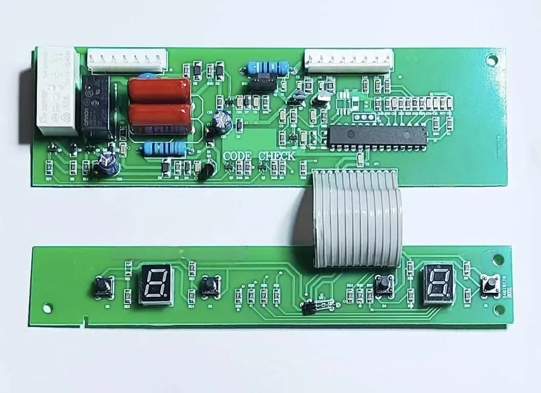 Green printed circuit board with black electronic components and a white retail box