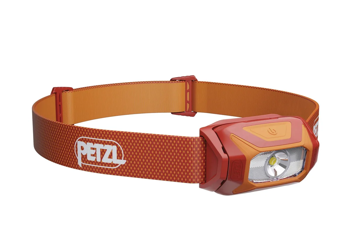 Compact red LED headlamp with adjustable headband and single button control